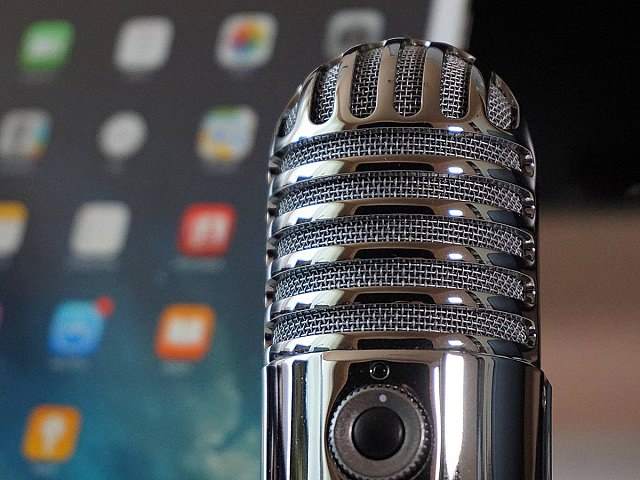 Microphone and tablet in background